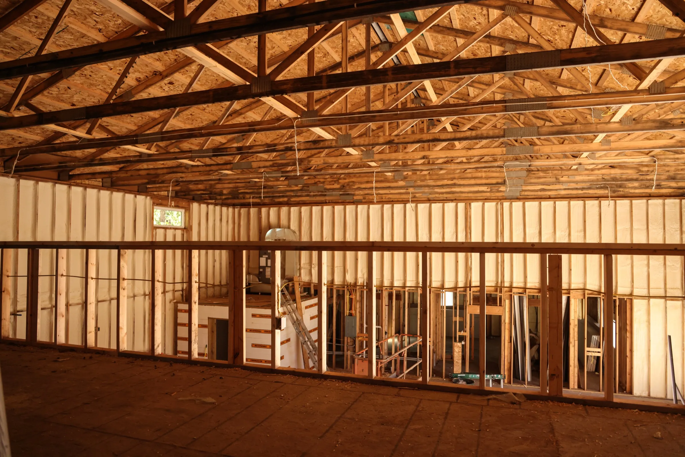 Batt insulation fitted between wall framing
